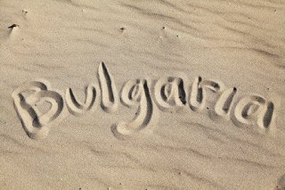 Bulgaria written in the sand at Sunny seashore