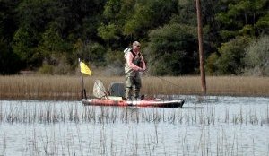 standing-in-a-kayak-to-fish